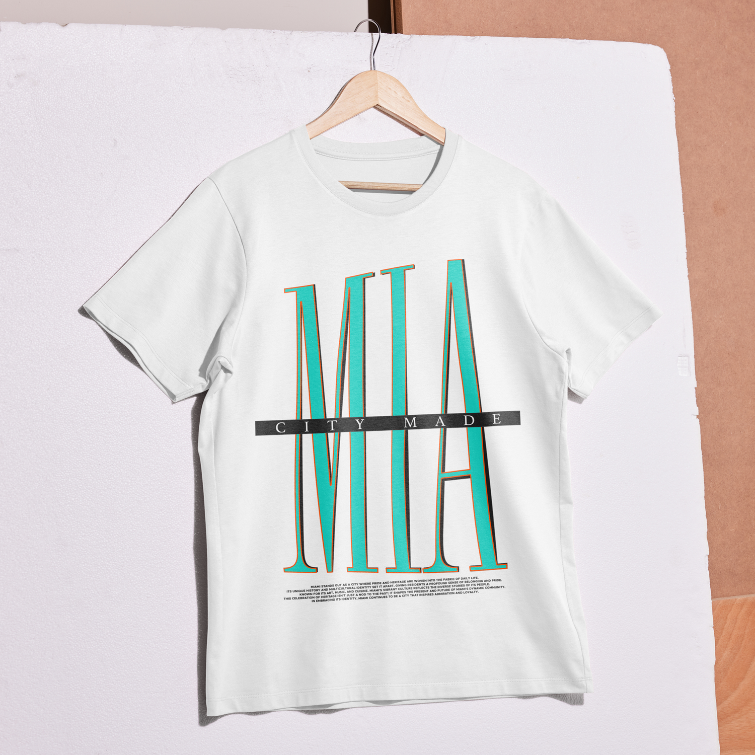 Miami City-Made T-Shirt on a hanger in a grungy, construction looking environment